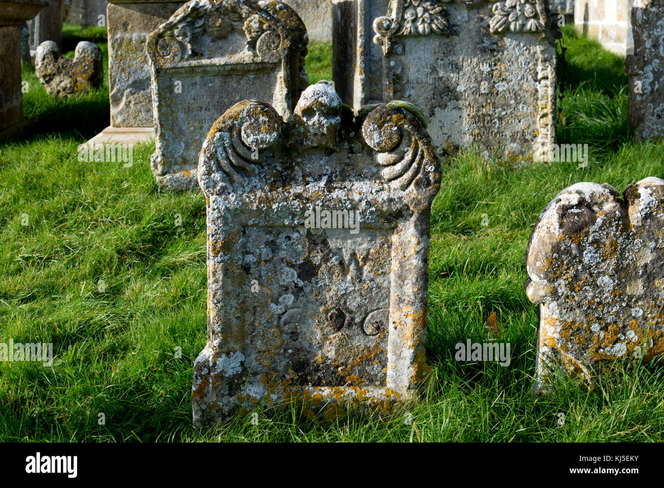 Old gravestones in St. Mary`s churchyard, Swinbrook, Oxfordshire